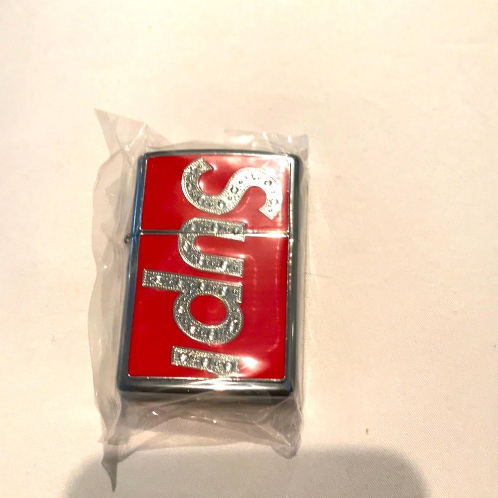Brand new 100% authentic unopened supreme zippo